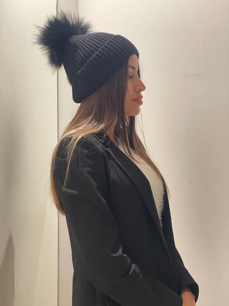 Cappello con pompom